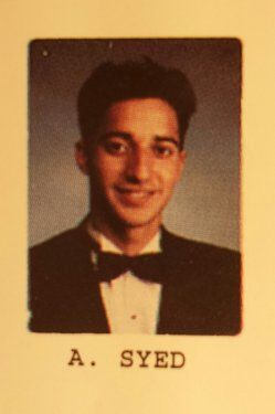 an old photo of a young man wearing a suit and bow tie with the words a sned on it