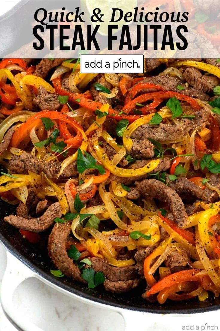 steak fajitas with peppers and onions in a skillet