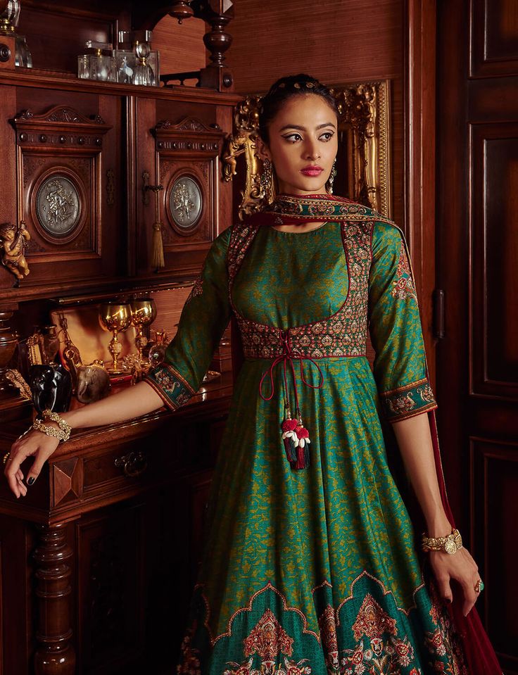 Editor's Note Featuring a hand painted and printed floral design anarkali, styled with a coordinated design border dupatta adorned with beads and sequins. Fabric: Anarkali: viscose silk, dupatta: net Color: Green Components: Anarkali and dupatta Occasion: Wedding Guest and festive Disclaimer: Product color may slightly vary due to photographic lighting sources or your monitor setting. Care: Dry Clean Only About the Designer Kalista is a luxury fashion label that specializes in designer clothing Kathak Costume, Contrast Dupatta, Anarkali With Dupatta, Green Anarkali, Shah Jahan, Coordinates Outfits, Printed Anarkali, Diwali Outfits, Indian Salwar