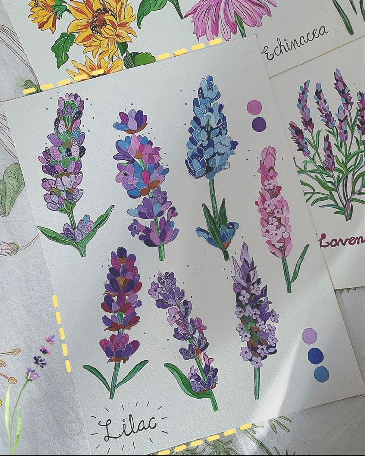 several different flowers are drawn on paper with colored pencils and watercolor pens in front of them