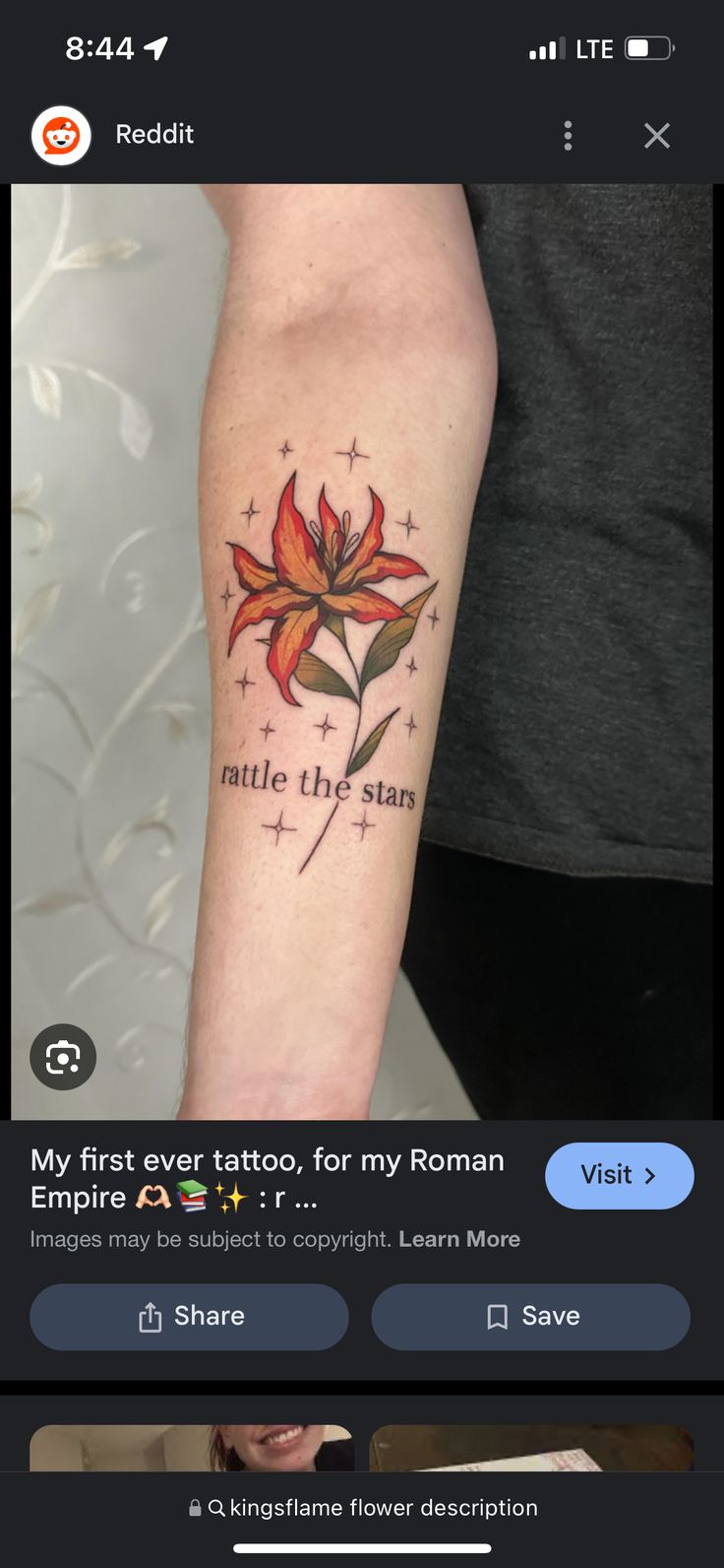 a woman's arm with a flower tattoo on it