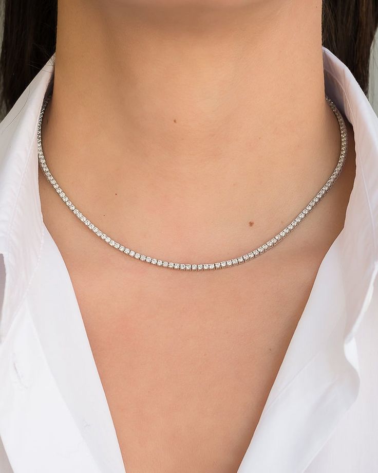 Discover the timeless elegance of our Lab Grown Diamond Tennis Necklace. With a stunning 4CTW, this necklace is perfect for adding a touch of luxury to your everyday wardrobe. 14kt white gold, 4 prongslide snap closureRound lab grown diamonds, GH Color, SI1 Clarity, 4 ctw16" length Diamond Chain Necklace, Necklace Outfit, Diamond Tennis Necklace, Butterfly Pendant Necklace, Jewelry Tags, 14k Gold Necklace, Diamond Chain, Tennis Necklace, Necklace Sizes