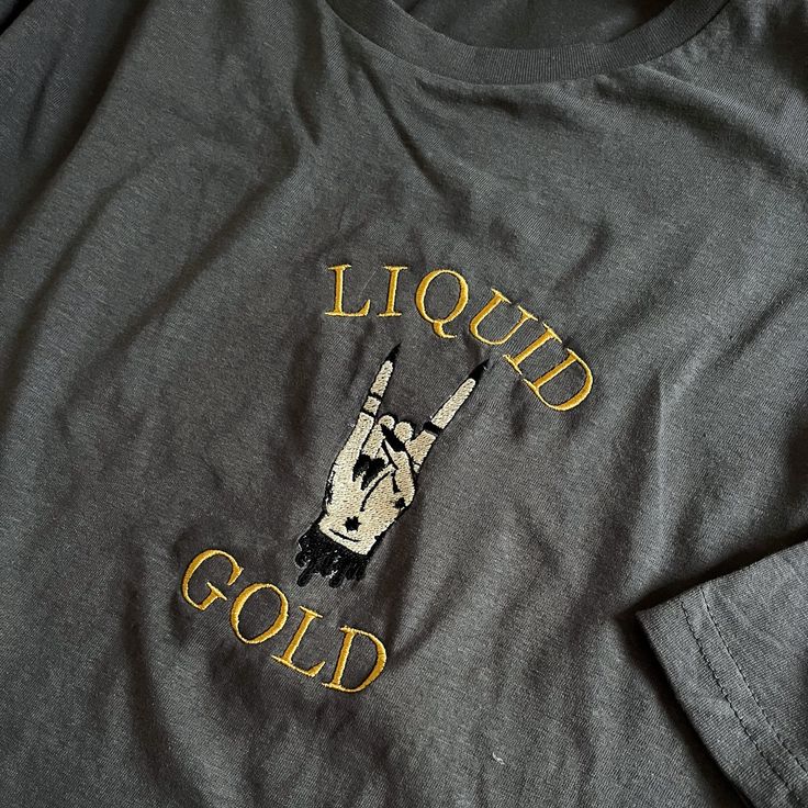 a t - shirt that says liquid gold on it