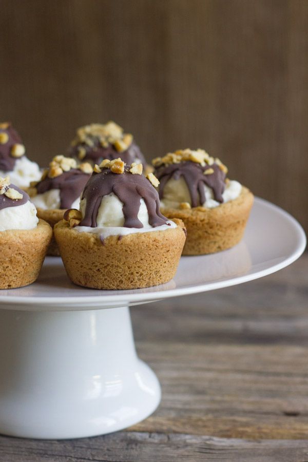 small ice cream sundae cookie cups on a cake plate