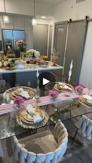 a dining room table is set with plates and place settings