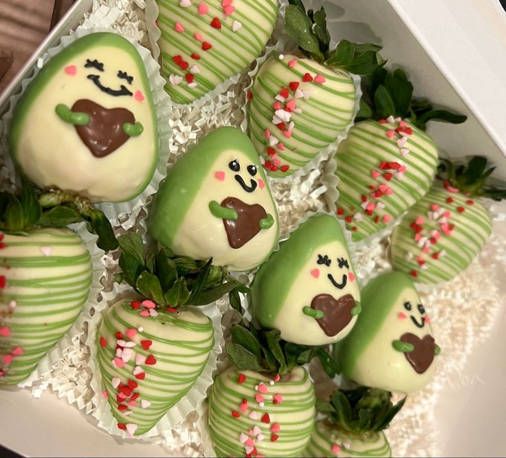 green and white chocolate covered strawberries in a box