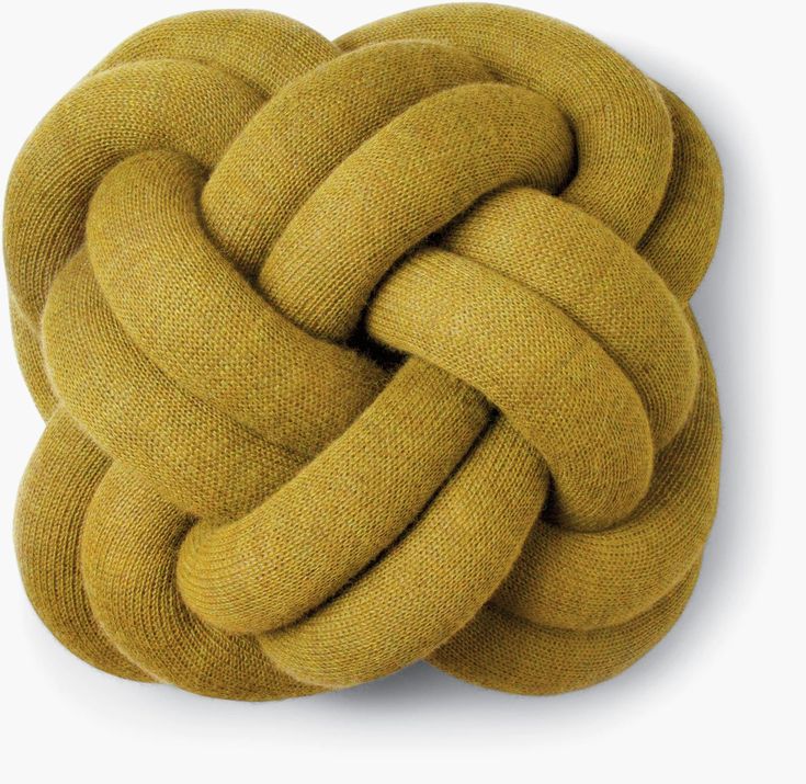 a large knot pillow is shown on a white background and it looks like an object