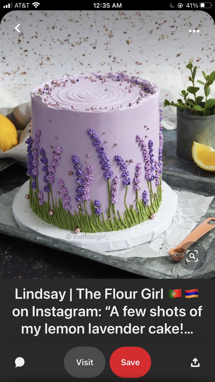 a purple cake with lavender flowers on it and the caption reads, lindsey i the flour girl on instagram a few shots of my lemon lavender cake