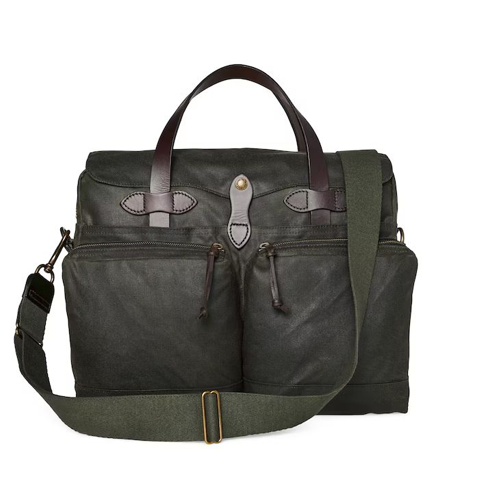 Filson 24 Hour Tin Briefcase Our 24-Hour Hour Tin Cloth Briefcase blends proven, traditional materials with old-world craftsmanship into a work bag that meets the requirements of the modern business traveler. We combined the computer-carrying capacity of our Padded Computer Bag with the sleek design of our Original Briefcase for a tool that does the job no matter where your work takes you. Whether you're navigating the daily commute or embarking on a weekend adventure, this Filson briefcase prom Filson Briefcase, Filson Bags, Computer Bag, Leather Hide, Work Bag, Computer Bags, Overnight Bag, Perfect Bag, Casual Look