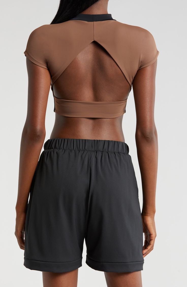 Cut from a double-layer knit with a banded hem, this cropped open-back T-shirt is supportive enough for the weight room and hot enough for the dance floor. Mock neck Short sleeves Nylon/spandex Machine wash, tumble dry Imported Seamless Cropped Tops For Athleisure, Seamless Athleisure Crop Top, Athleisure Seamless Crop Top, Compressive Summer Crop Top, Sporty Compressive Cropped Tops, Compressive Crop Top With Built-in Bra, Compressive Cropped Top With Seamless Construction, Versatile Medium Support Crop Top, Versatile Cropped Sports Top