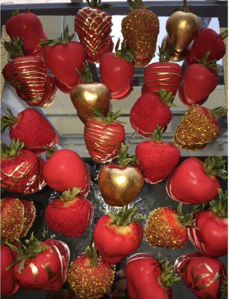 strawberries and chocolate covered strawberries are arranged in the shape of hearts