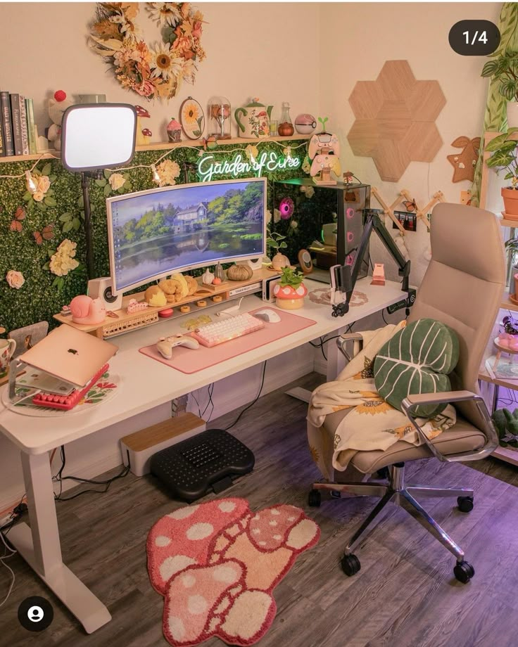 a desk with a computer, chair and other items on it in front of a window