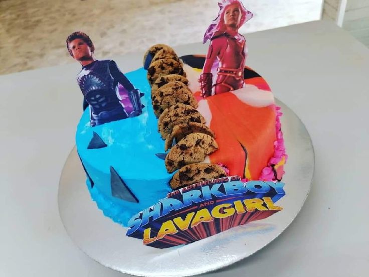 there is a cake decorated with the characters of ant - man and the waspman