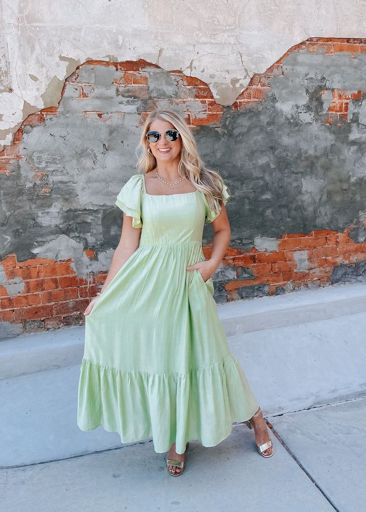 Elevate your style with the You Already Know Maxi Dress! This stunning maxi dress features a square neckline and ruffled short sleeves, perfect for a feminine touch. The smocked backing provides a comfortable and flattering fit, while the soft green color adds a touch of elegance. Plus, with convenient pockets, you'll have everything you need at your fingertips. Perfect for any occasion, this dress is a must-have in your wardrobe. Chic Green Maxi Dress With Puff Sleeves, Casual Maxi Dress With Ruffle Hem And Square Neck, Green Flutter Sleeve Maxi Dress For Summer, Green Maxi Dress With Smocked Back For Day Out, Green Puff Sleeve Maxi Dress For Summer, Modest Green Maxi Dress For Brunch, Casual Green Midi Dress With Puff Sleeves, Modest Square Neck Summer Dress, Green Flutter Sleeve Maxi Dress For Brunch