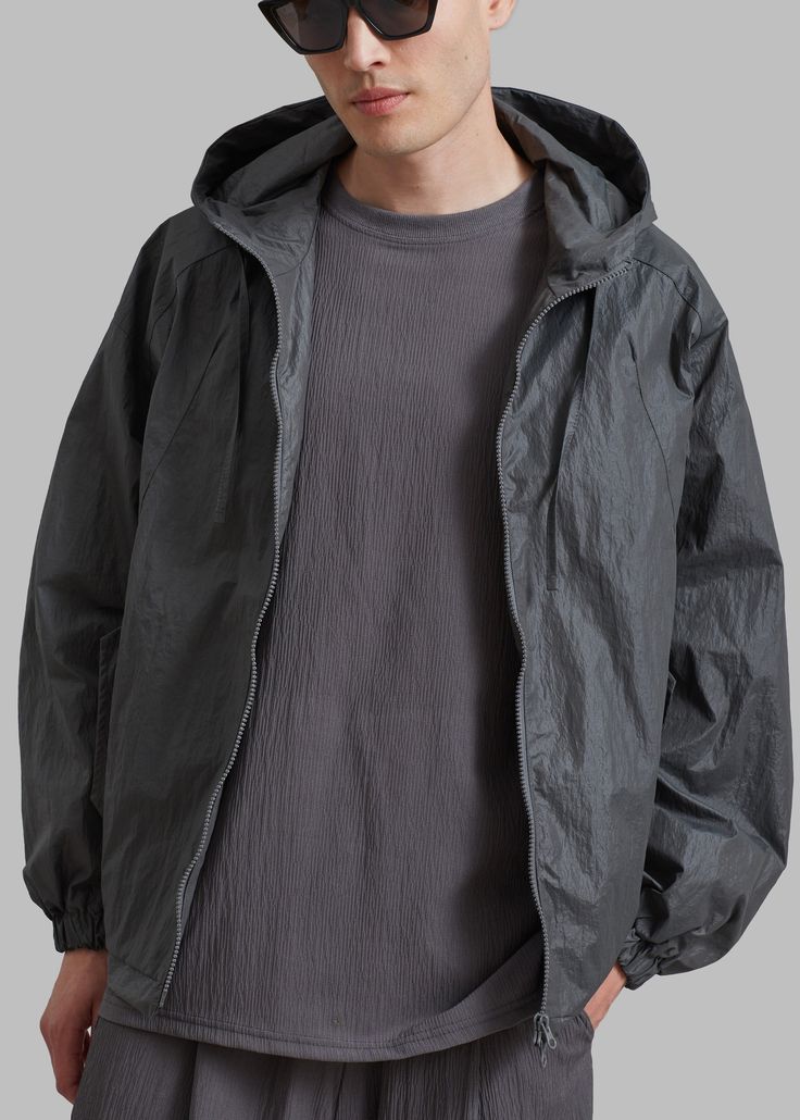 Color: Charcoal Woven technical fabric Relaxed fit Drawstring hood Drop shoulders Front flap pockets with snap button closure Elastic cuffs Partially elasticated hem Front zip closure Lined 100% Polyamide Dry Clean Imported One Size Flap Pocket, Drop Shoulder, Sleeve Length, Relaxed Fit, How To Wear