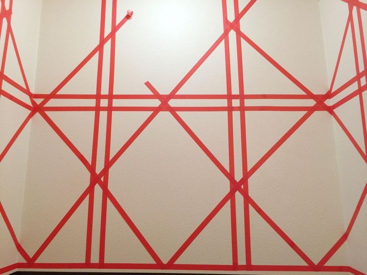 a white wall with red lines painted on it