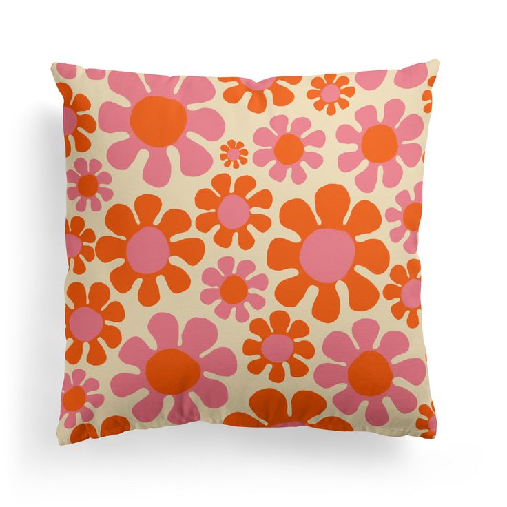 an orange and pink pillow with flowers on it