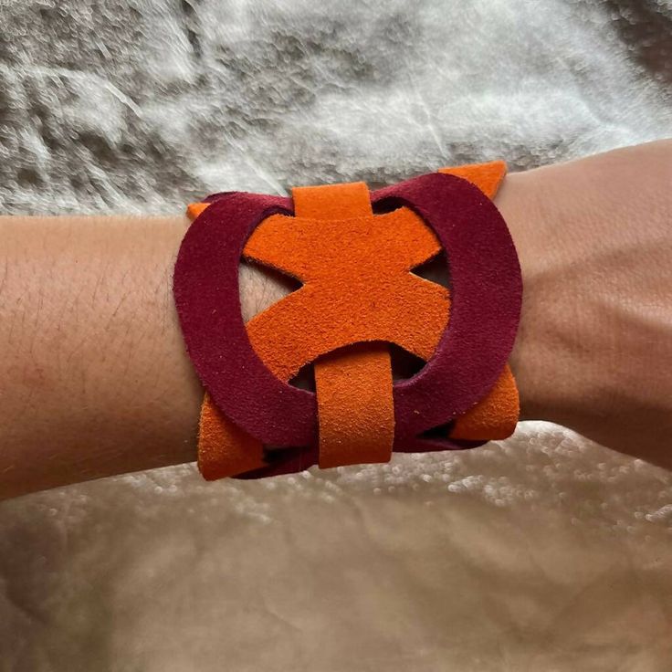 Handcrafted in Argentina by artisans. 100% leather bracelet. Handmade Brown Leather Friendship Bracelet, Bold Adjustable Bracelets As Gift, Unique Adjustable Leather Bangle Bracelet, Adjustable Orange Cuff Bracelet, Trendy Handmade Cuff Bracelet, Handmade Multicolor Leather Bracelets, Modern Handmade Leather Cuff Bracelet, Handmade Modern Leather Cuff Bracelet, Handmade Orange Adjustable Cuff Bracelet