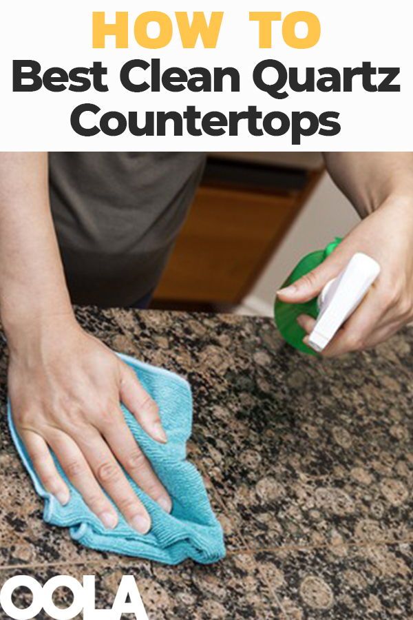 a person wiping up the counter top with a cloth and microfiber on it