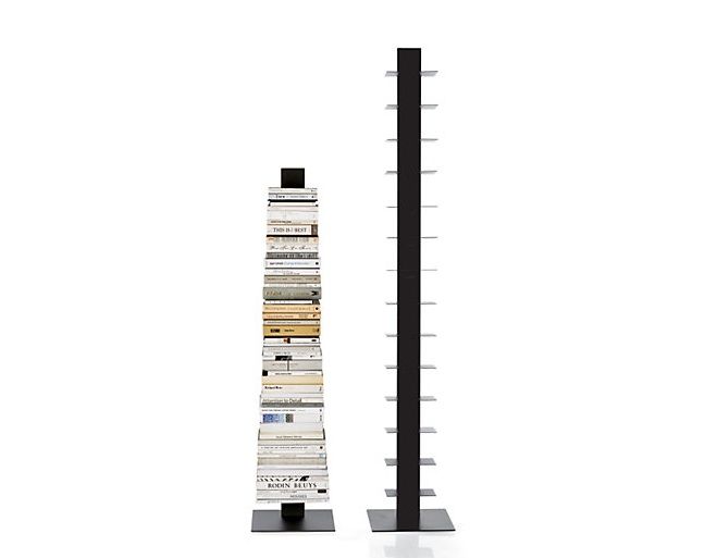 a tall book stand with several books on it's sides and a black pole next to it