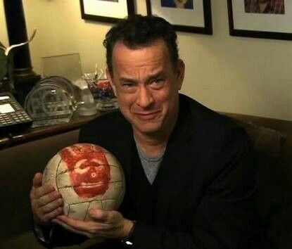 a man holding a soccer ball with the words feliz dia do amigo on it