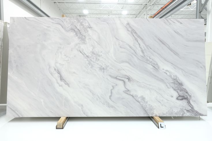 a large white marble slab in a warehouse