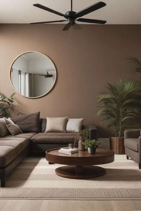 a living room filled with furniture and a large round mirror on the wall above it