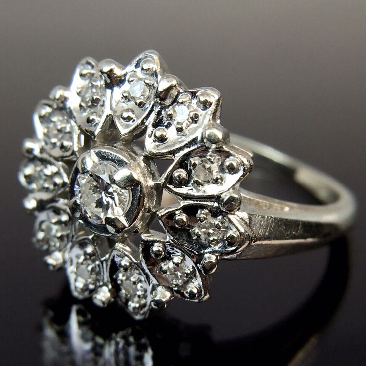 Metal:14k White Gold Weight:4.8 Grams Size:7 CTW:0.34 Carats 1 3.5mm diamond, approx. 0.17 carats 11 1.5mm diamonds, approx. 0.17 carats Make an offer! Dazzling Marquise Cut Diamond Ring With Single Cut Diamonds, Dazzling Diamond Cluster Ring With Single Cut Diamonds, Silver Platinum Ring With Diamond Accents, Dazzling Cluster Diamond Ring With Single Cut Diamonds, Diamond White Cluster Ring With Single Cut Moissanite, 14k White Gold Diamond Ring In Marquise Cut, Classic Diamond Cluster Ring With Halo Setting, Silver Brilliant Cut Diamond Ring In 14k White Gold, Moissanite Cluster Ring With Single Cut Diamonds For Anniversary