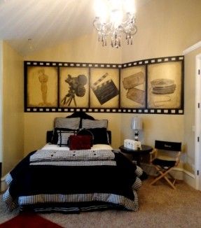 a bed room with a neatly made bed and pictures hanging on the wall above it