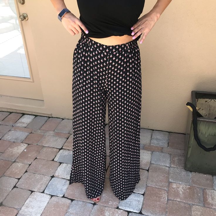 New With Tags, Black With Small Diamond Pattern, Wide Leg Flowy, High Waisted Pants With Slits On Either Side. Lightweight Material, Perfect For Summer, Festivals, Relaxed Weekend Looks. Size S Casual Relaxed Fit Bottoms For Night Out, Versatile Black Pants For Day Out, Relaxed Fit Bottoms With Elastic Waistband For Night Out, Black Wide Leg Pants For Vacation, Black High-waist Wide Leg Pants For Day Out, Casual Wide Leg Full Length Pants For Night Out, Casual Full Length Bottoms For Night Out, Casual Wide-leg Pants For Night Out, Black Trousers For Vacation