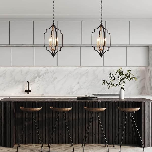 a kitchen with marble counter tops and stools next to an island that has three lights hanging from it