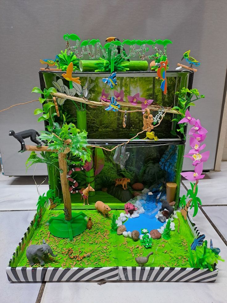 this is an image of a zoo scene made out of cake