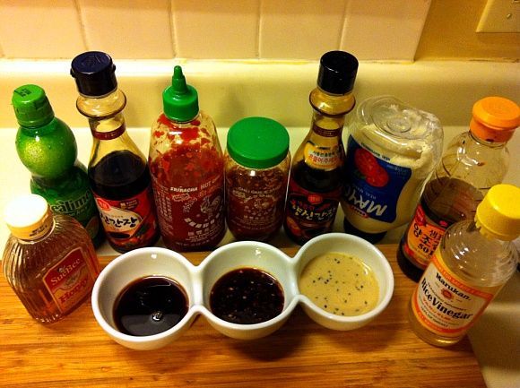 various condiments are arranged on a kitchen counter