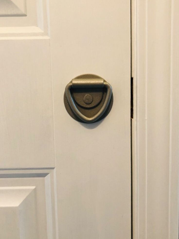 an open door with a metal handle on it