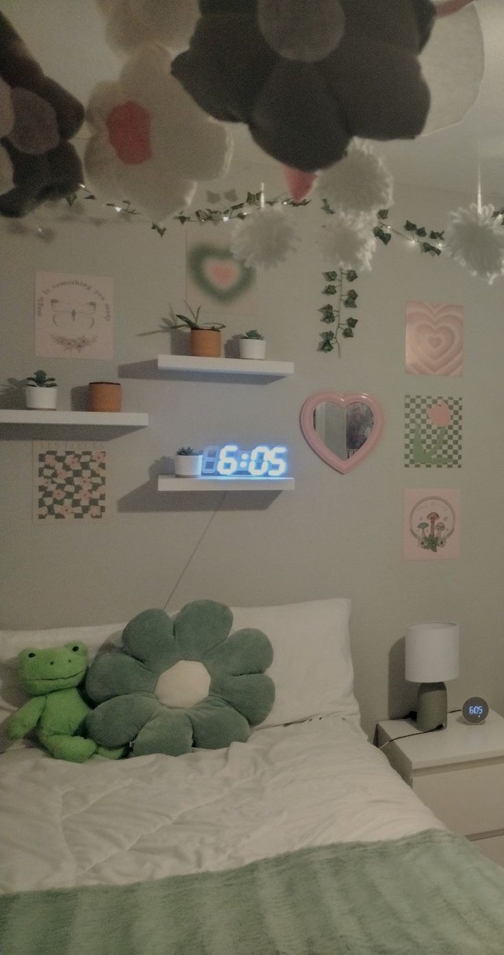 a bed room with a neatly made bed and lots of decorations on the wall above it