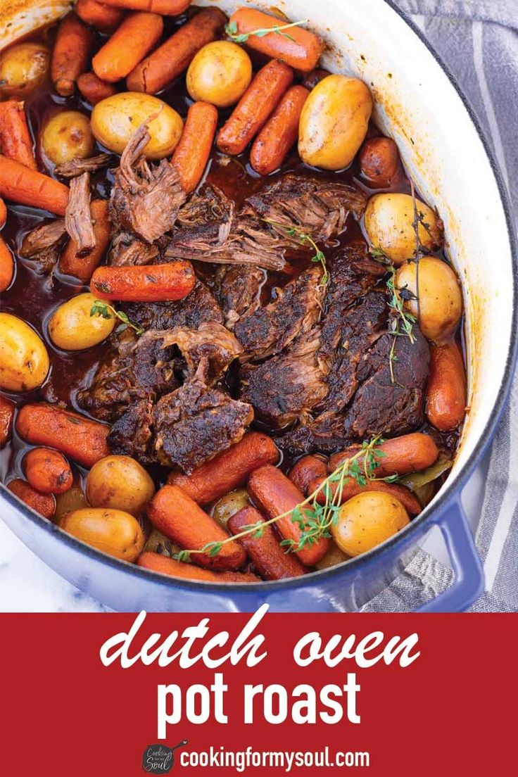 pot roast with carrots, potatoes and meat in a dutch oven on a table