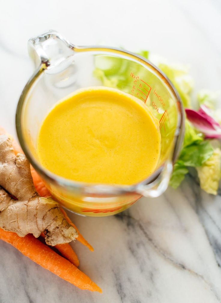 carrots and ginger juice on a marble table