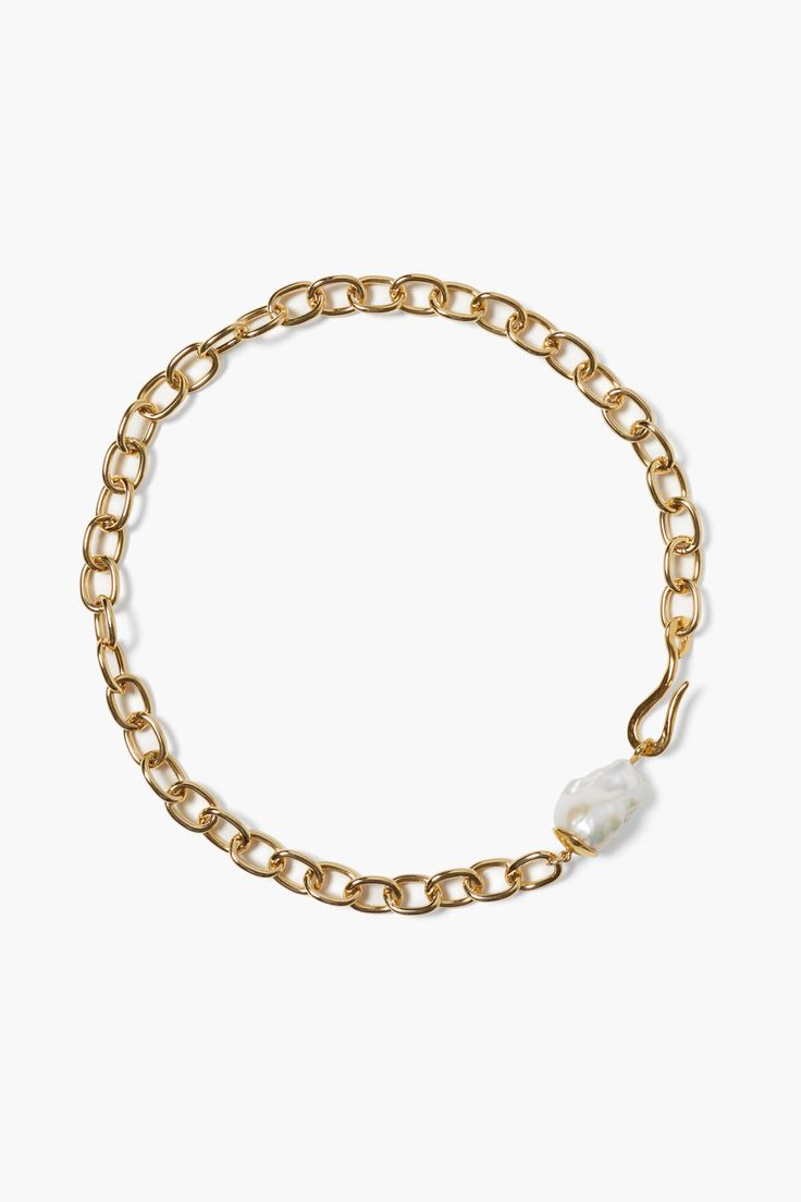 A classic gold plated base metal chain necklace is elevated by a bold baroque pearl and overized hook clasp. A timeless design perfect on its own or styled with more gold necklaces. Baroque pearls are one of a kind so size and shape may vary.Base metal.17" in length.Handmade in Vietnam. Magpie Collection, Brass Chain Necklace, Well Traveled, Making Things, Gold Necklaces, Chan Luu, Hook Clasp, Classic Gold, Timeless Accessories