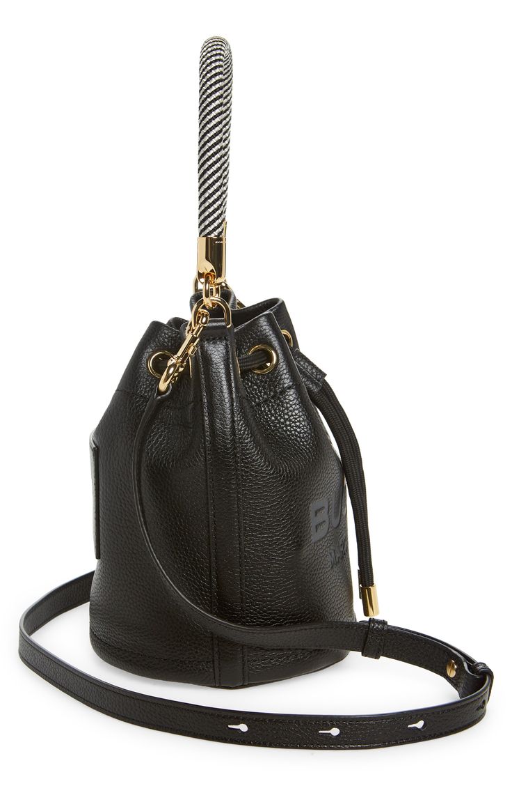 Signature logo detailing and a softly gathered silhouette distinguish this vibrant leather bucket bag with a detachable webbing strap for easy carry. Drawstring closure Top carry handle; removable, adjustable crossbody strap Structured silhouette with flat base for stability Twill lining Leather Imported Webbing Strap, Leather Bucket Bag, Leather Bucket, Signature Logo, Crossbody Strap, Marc Jacobs, Bucket Bag, Nordstrom, Leather