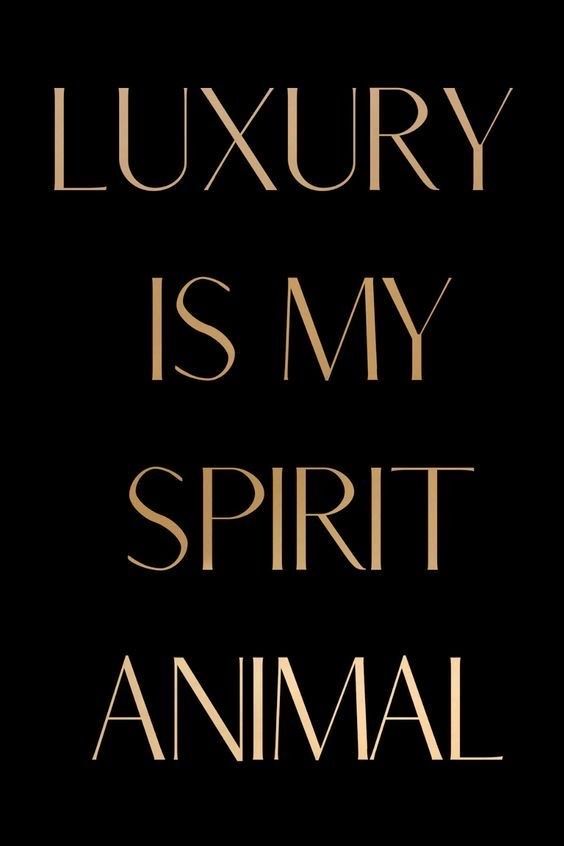 the words luxury is my spirit animal in gold on a black background with an image of a