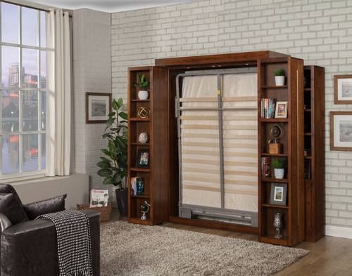 a living room with a couch, chair and bookcase in front of a window