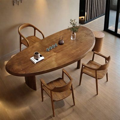 a wooden table with four chairs around it