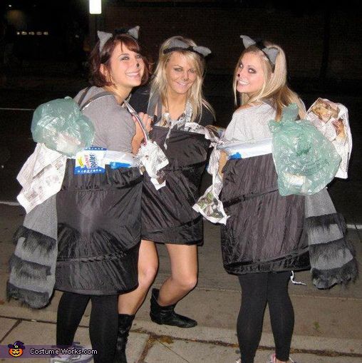 three women dressed in costumes posing for the camera