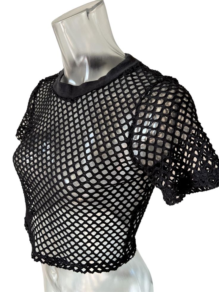 Live your techno dreams in our industrial fishnet crop tee. This curated find is super soft and is a great layering piece for any rave. Get ready for this top to become a new staple into your wardrobe! *ALL ITEMS ARE FINAL SALE* Cropped Fishnet Top, Black Fishnet Top, Techno Clothes, Crop Top Styles, Hot Topic Shirts, Dystopian Fashion, Techno Fashion, Fishnet Top, Rave Fashion