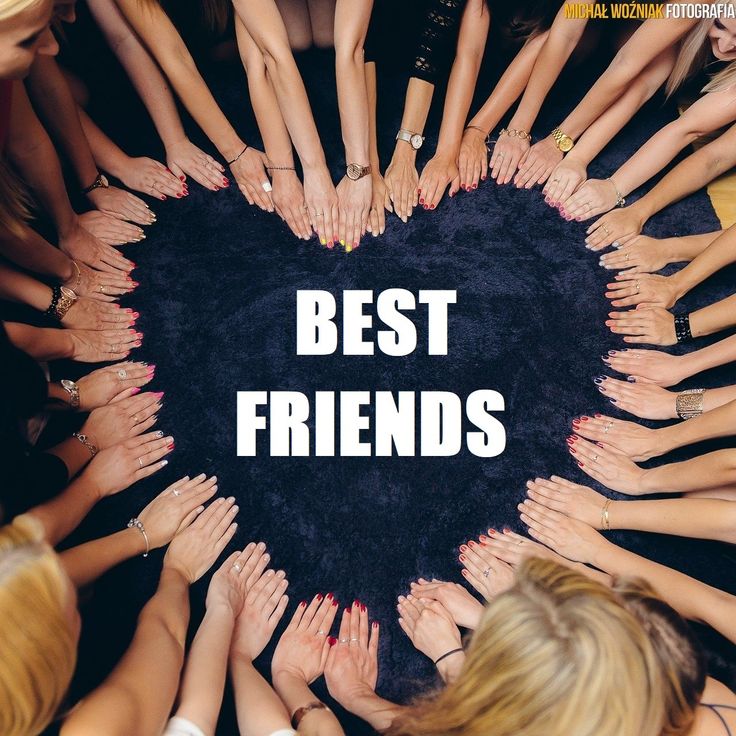 a group of women holding their hands together in the shape of a heart that says best friends