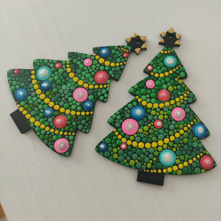 three christmas trees made out of buttons on a white surface with green, yellow and pink dots