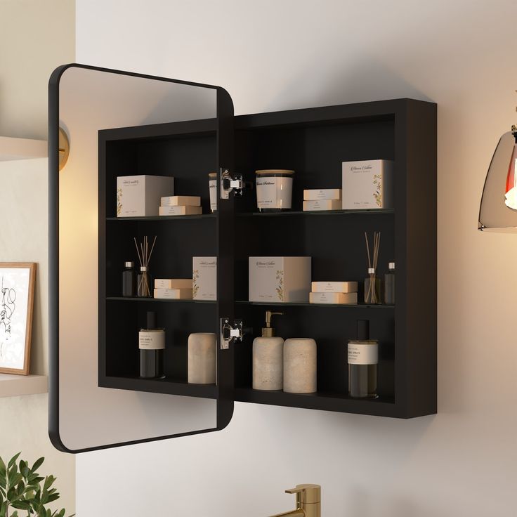 a mirror mounted to the side of a wall next to a shelf filled with items