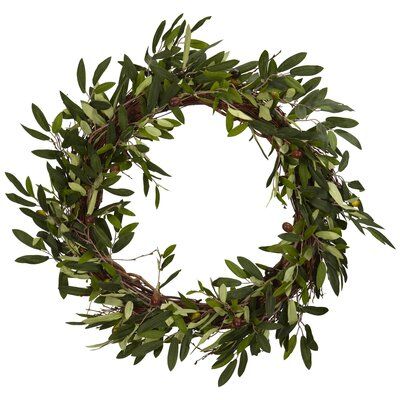 a circular wreath with green leaves on a white background