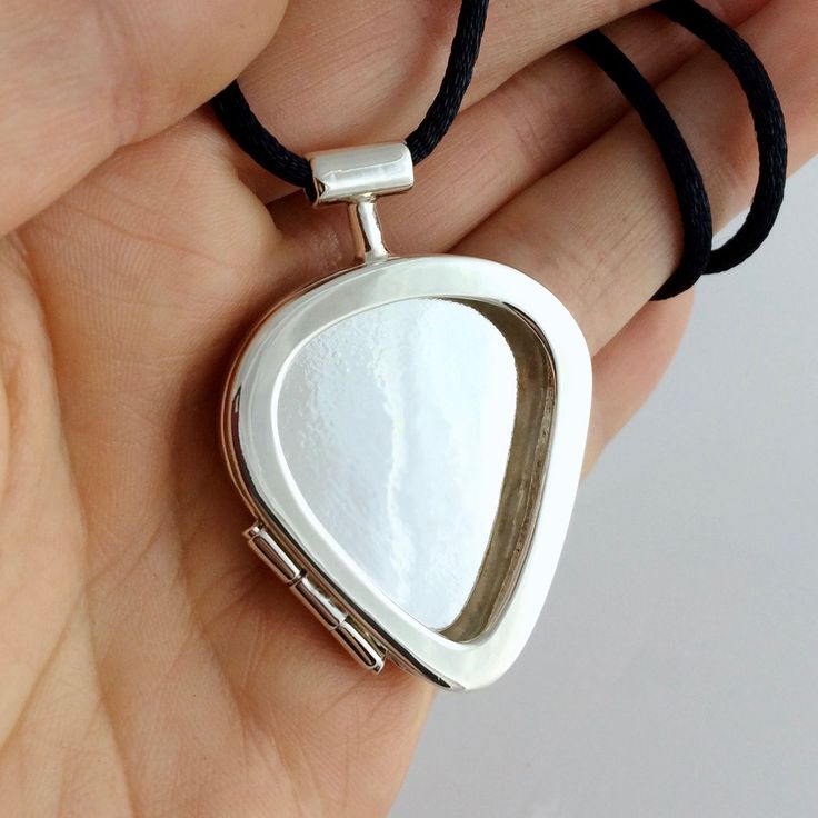 Buy a Custom Made Guitar Pick Locket In Sterling Silver, made to order from DiPiazza Handmade | CustomMade.com Pretty Instruments, Cool Guitar Picks, Singer Dr, Guitar Pick Jewelry, Silk Cord Necklace, Music Jewelry, Music Accessories, Guitar Stuff, Dope Jewelry