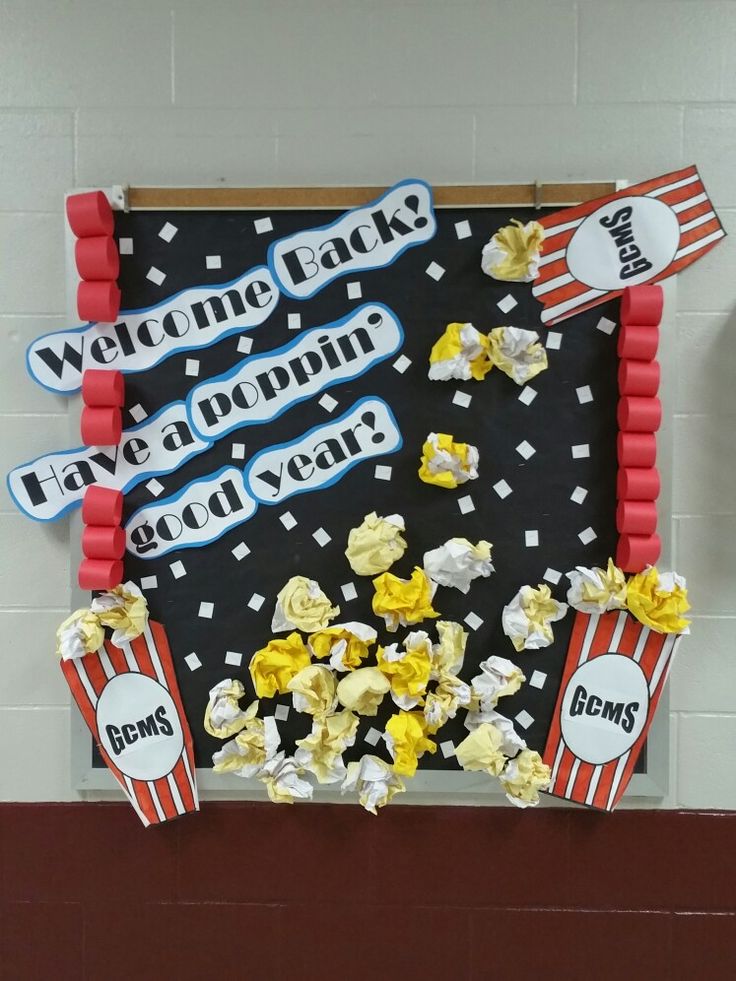 a bulletin board with popcorn and movie tickets